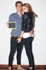 Image showing Portrait, fashion and chalkboard with a hipster couple on white wall background together for marketing. Education, advertising or space with a young man and woman on a school campus for relationship