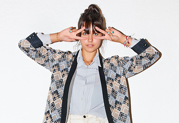 Image showing Fashion, peace sign and portrait of woman on a white background with pride, confidence and emoji. Model, hand gesture and isolated person in trendy clothes, casual outfit and style in studio