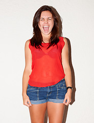 Image showing Angry, shouting and a woman on a white background while frustrated, crazy or mental health expression. Studio, anger and a young girl screaming on a backdrop for anxiety, depression or upset