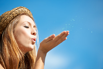 Image showing Mockup, blue sky and a woman blowing glitter for celebration, event or a party in the city. Shimmer, closeup and a young girl with confetti or sparkle for a trend, wish or hope from a funky hipster