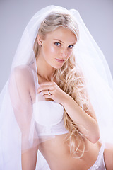 Image showing Portrait, bride and woman with lingerie, beauty and confident on a white studio background. Person, model and girl with wedding, honeymoon or underwear with intimacy, luxury and fashion with marriage
