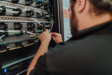 Image showing Close up of technician setting up network in server room