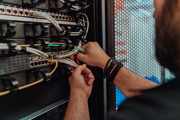 Image showing Close up of technician setting up network in server room