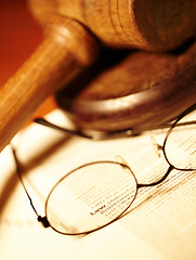Image showing Law table, report and glasses for justice, notes or work in the courtroom. Paperwork, knowledge and eyewear on an attorney desk for order, legal job or advocate trial for a judgment or crime defense