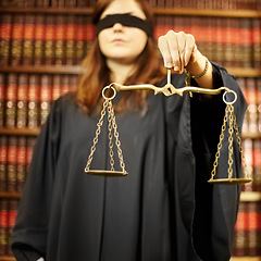 Image showing Blindfolded, lawyer and closeup of a scale for justice, court decision or criminal advocate. Office, working or a legal employee holding a tool for judge, notary or legislation in the workplace