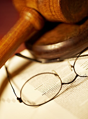 Image showing Law table, document and glasses for jury, notes or work in the courtroom. Paperwork, knowledge and eyewear on an attorney desk for order, legal job or advocate trial for a judgment or crime defense