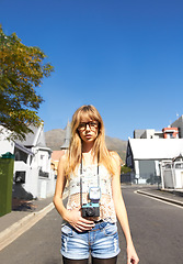 Image showing Travel, photography and portrait of woman with camera for creative and art career in the city. Glasses, gen z and young female person from Australia with dslr equipment on weekend trip in town.