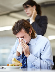 Image showing Businessman, nose blow or office colleague disgusted or sick allergies, flu symptoms or sinusitis at lunch. Male person, woman or job tissue or cold sneeze hygiene, hay fever allergy or virus germs