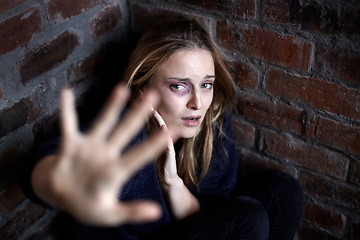 Image showing Portrait, abuse and woman with stop, scared and fear in a corner, warning and domestic violence with terror. Face, person or girl with gesture, gender equality or victim with anxiety, stress or crime