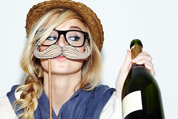 Image showing Face, champagne and costume with a woman in studio isolated on a white background to party for celebration. Alcohol, mustache and character with a young person drinking or having fun at an event