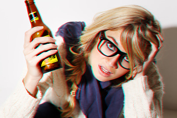 Image showing Portrait, fashion and a bottle of beer with a woman in studio isolated on a white background feeling dizzy closeup. Face, alcohol and headache with a young drunk person drinking at a party or event