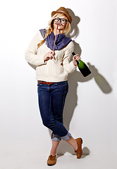 Image showing Portrait, woman and holding moustache with champagne for photo or comic on a white background for fun. Funny, alcohol and girl with a prop at an event for crazy, comedy and celebration for a picture