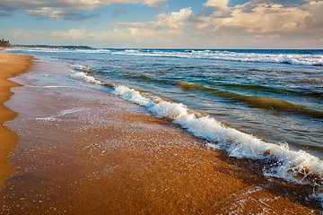 Image showing Wave surging on sand