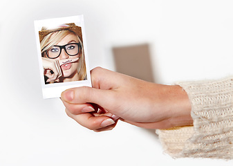 Image showing Hand, photograph of a woman with a finger mustache and print in studio isolated on a white background. Face, photo booth picture and a young person closeup at a party or event for celebration