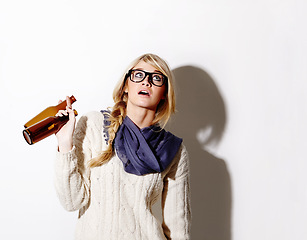 Image showing Beer, drink or woman with mockup space for fun celebration, party or hipster event in studio. Thinking, girl or female person drinking alcohol or beverage in bottle looking up on white background