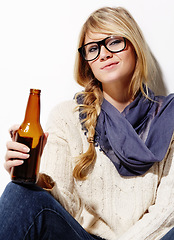 Image showing Woman, portrait and relax with beer or drink of nerd, geek or hipster on a studio white background. Attractive young female person or model with glasses, cool or fashion style holding alcohol bottle