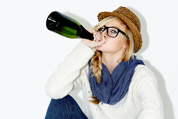 Image showing Fashion, drinking and woman with wine in studio with trendy, cool and stylish outfit and accessories. Alcohol, portrait and female model from Australia with edgy and casual style by white background.