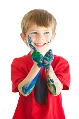 Image showing Smile, paint and a naughty or messy boy in studio isolated on a white background for art as a creative. Children, hands and a happy young kid looking excited by the creativity of artistic painting