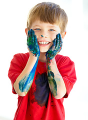 Image showing Portrait, smile and paint with a creative boy in studio isolated on a white background for art or education. Face, hands and messy with a happy young child student touching his cheeks in excitement