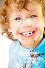 Image showing Portrait, mess and flour with a boy in the kitchen of his home, learning how to cook for child development. Children, bake and a happy young kid looking naughty with food ingredients on his face