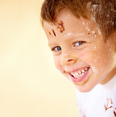 Image showing Portrait, happy and flour with a boy in the kitchen of his home, learning how to bake for child development. Children, smile and cooking with a young kid looking naughty with ingredients on his face