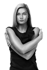 Image showing Portrait, black and white fashion and a woman in studio isolated on a white background for trendy style. Classy, elegant and artistic clothes with a confident young model posing in an outfit