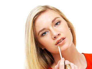 Image showing Beauty, portrait and woman in studio with lipgloss application, color lips and facial cosmetics. Fashion, makeup product and face of girl with brush, lipstick on mouth isolated on white background.