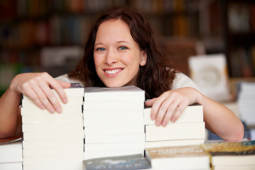 Image showing Woman, bookstore business owner and smile in portrait by stack for discount, sale or pride for promotion. Entrepreneur, library and happy for retail deal, literature or knowledge for learning in shop