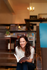 Image showing Woman, reading and smile in bookshop, portrait and relax on stairs with knowledge, information and literature. Girl, book and happy for learning, education or studying on steps with research in store