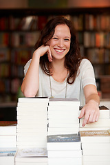 Image showing Woman, bookstore business owner and happy in portrait by stack for discount, sale or pride for promotion. Entrepreneur, library and smile for retail deal, literature or knowledge for learning in shop