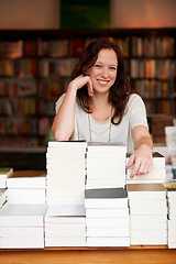 Image showing Woman, bookshop business owner and smile in portrait by stack for discount, sale or pride for promotion. Entrepreneur, library and happy for retail deal, literature or knowledge for learning in store