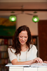 Image showing Reading, books and woman in bookstore, library or shop for research, learning and relaxing. Literature, customer and happy person with book for education, information and studying for hobby or fun