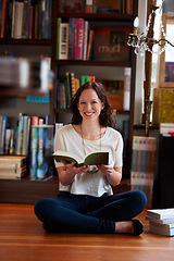 Image showing Reading, books and portrait of woman on floor in bookstore, library or shop for research, learning and relax. Literature, customer and happy person with book for education, information and knowledge