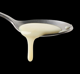 Image showing condensed milk in a spoon