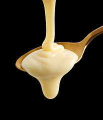 Image showing pouring condensed milk