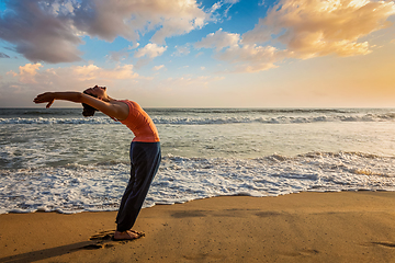 Image showing Woman doing yoga Sun salutation Surya Namaskar