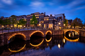 Image showing Amsterdam canal, bridge and medieval houses in the evening