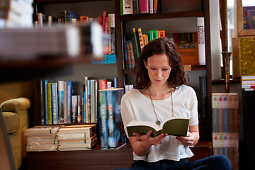 Image showing Woman, reading and floor in bookstore, library or relax for thinking for knowledge, information or literature. Girl, books and ideas for learning, education or studying on steps with research in shop