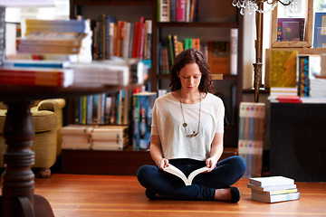 Image showing Woman, reading and floor in bookshop, library or relax for thinking for knowledge, information or literature. Girl, books and ideas for learning, education or studying on steps with research in store
