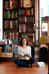 Image showing Woman, reading and floor in bookstore, portrait or relax with development for knowledge, information and literature. Girl, books and ideas for learning, education or studying with research in shop