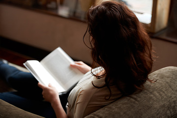 Image showing Reading, books and woman on sofa to relax in bookstore, library or shop for research, learning and study. Literature, knowledge and person with book for education, information and studying for hobby