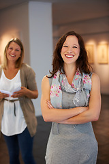 Image showing Smile, arms crossed and portrait of a woman with pride in art, exhibition and work at a gallery. Happy, learning and a museum manager or employee at a job for creativity, teaching and culture