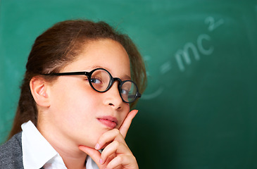 Image showing Portrait of student, nerd and kid by chalkboard in class for learning knowledge, education and study math on mockup space. Face, glasses and geek at school, girl or cute child in classroom in Spain