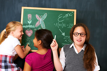 Image showing Chalk, board and portrait of child student teaching friends for an education lesson or learning. Smile, happy and girl kid studying with classmates for knowledge at school or academy with scholarship