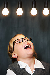 Image showing Light bulbs, smile and child student with glasses for thinking, idea or solution brainstorming. Excited, learning and happy girl kid with positive attitude for education with planning face expression