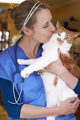 Image showing Veterinary, woman and kiss cat with smile for healthcare, consultation or health examination at clinic or hospital. Medical, animal or doctor with happiness for wellness, checkup or vaccine at vet