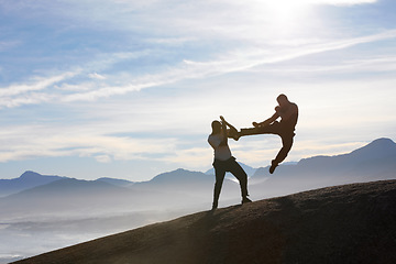 Image showing Mountain top, karate men and jump, kick or fitness training in nature for body, speed or power on sky background. Martial arts, taekwondo or MMA friends workout outdoor for cardio, exercise or sports