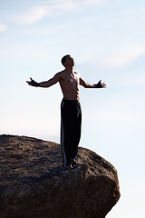 Image showing Mountain top, freedom and fitness man with open arms in nature for training, wellness or sports on sky background. Exercise, success and athlete with morning cardio, gratitude or workout celebration