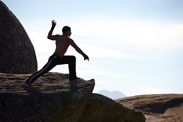 Image showing Mountains, kickboxing and man with training, exercise and fresh air with wellness, fighting and nature. Person, athlete and guy with practice, fitness and outdoor with workout, karate and challenge