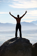 Image showing Mountain top, success and back of fitness man stretching arms in nature for performance celebration on sky background. Exercise, freedom and rear view of male athlete with workout, energy or victory